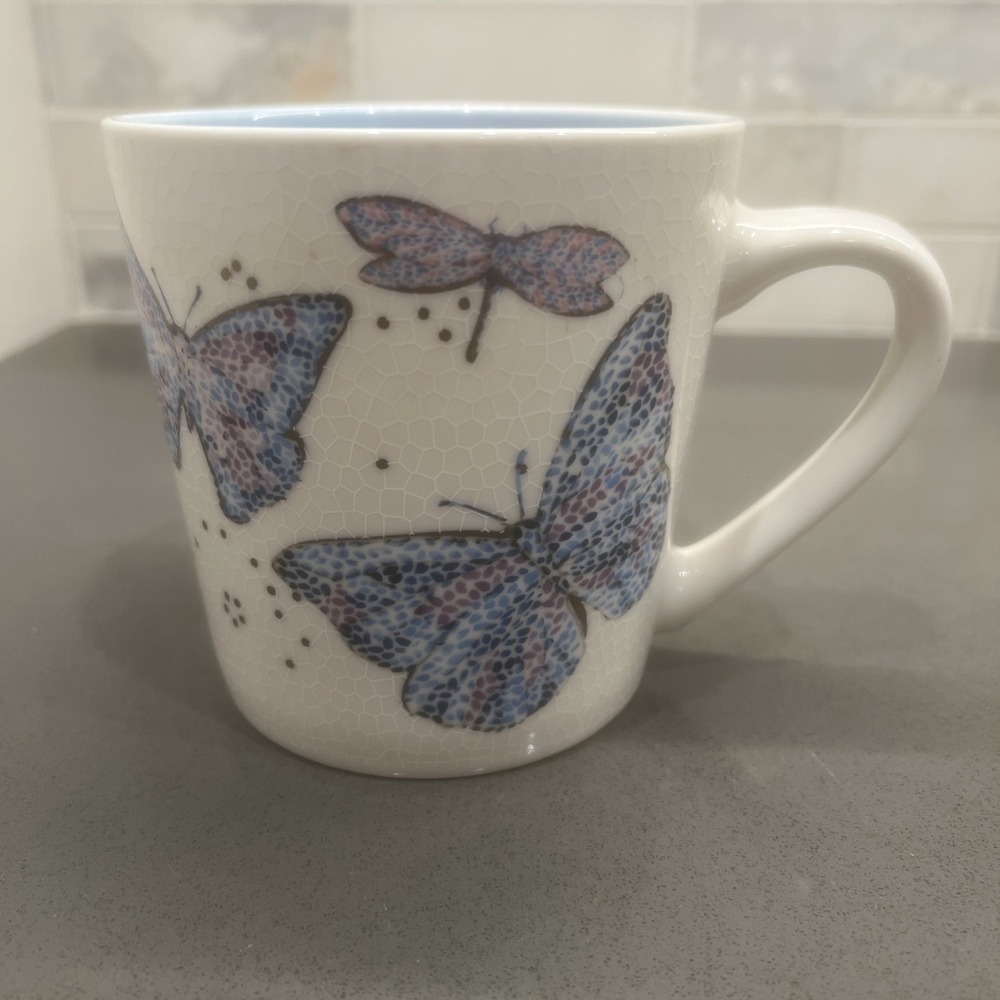 Seeds & Sunshine Butterfly Ceramic Coffee Mug White Speckled Blue Rim